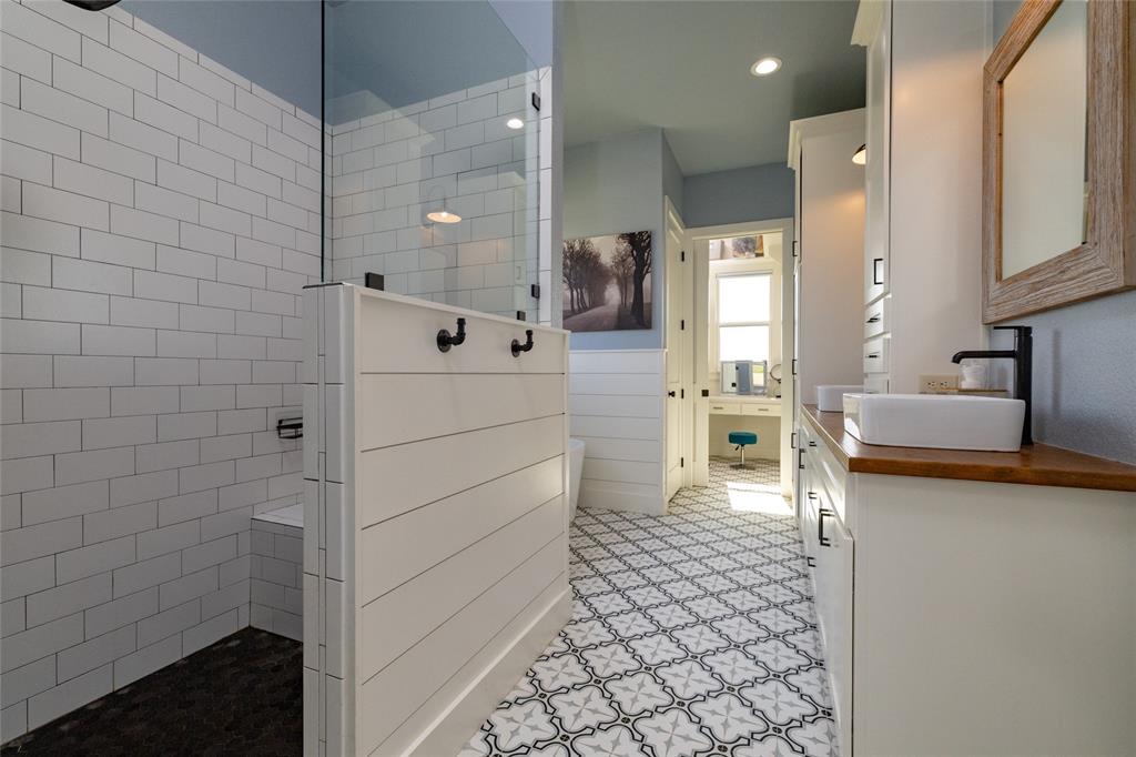 338 County Road 4223 Decatur, TX 76234 - Photo 26 of 37 Primary Bathroom w walk-in shower, separate tub, dual sink vanity and dual closets. The view is toward one of the closets with a make up vanity.
