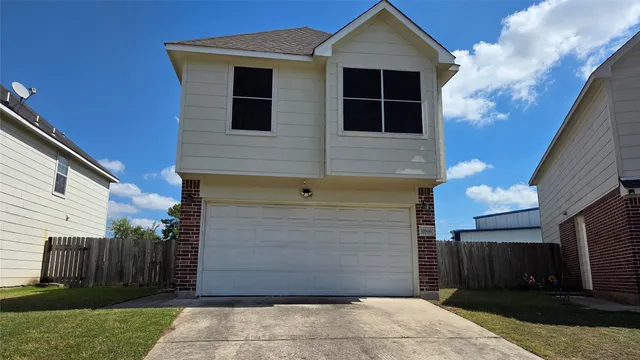 a front view of a house with garage