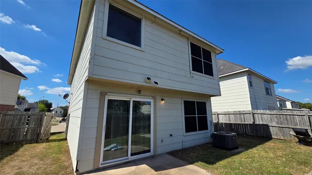 a view of a house with a balcony and door