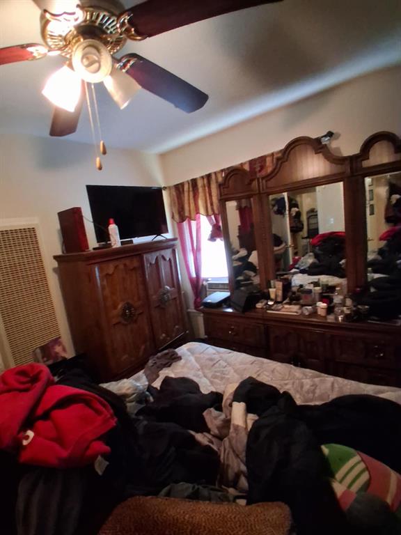 1015 East Morphy Street Fort Worth, TX 76104 - Photo 11 of 23 Bedroom with a ceiling fan and a heating unit