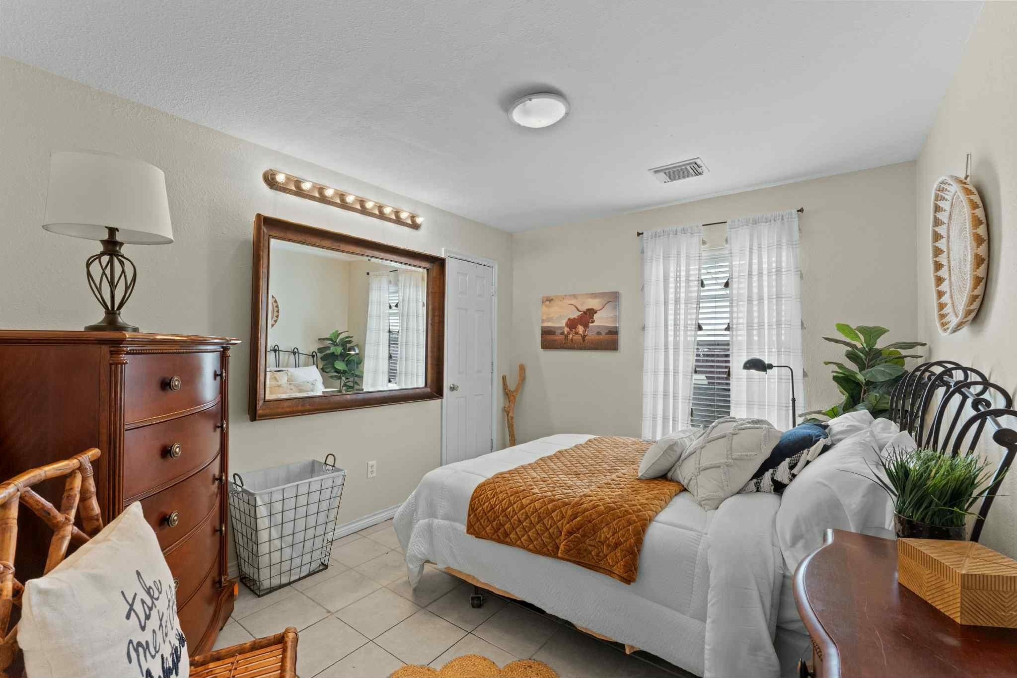 2102 North Pearland Avenue Pearland, TX 77581 - Photo 16 of 29 a bedroom with a bed and a window