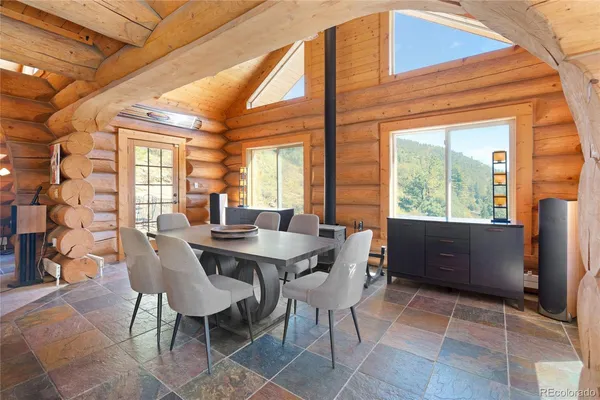 a view of a dining room with furniture window and outside view