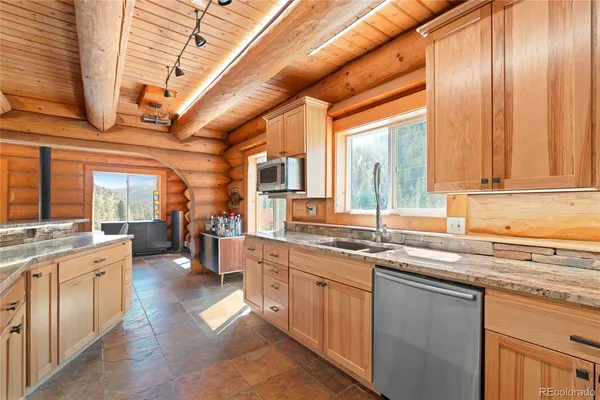 a kitchen with lots of counter top space and a sink