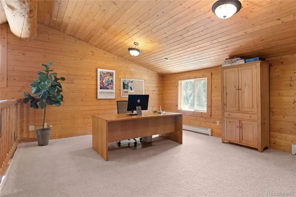 a view of kitchen with furniture and a potted plant