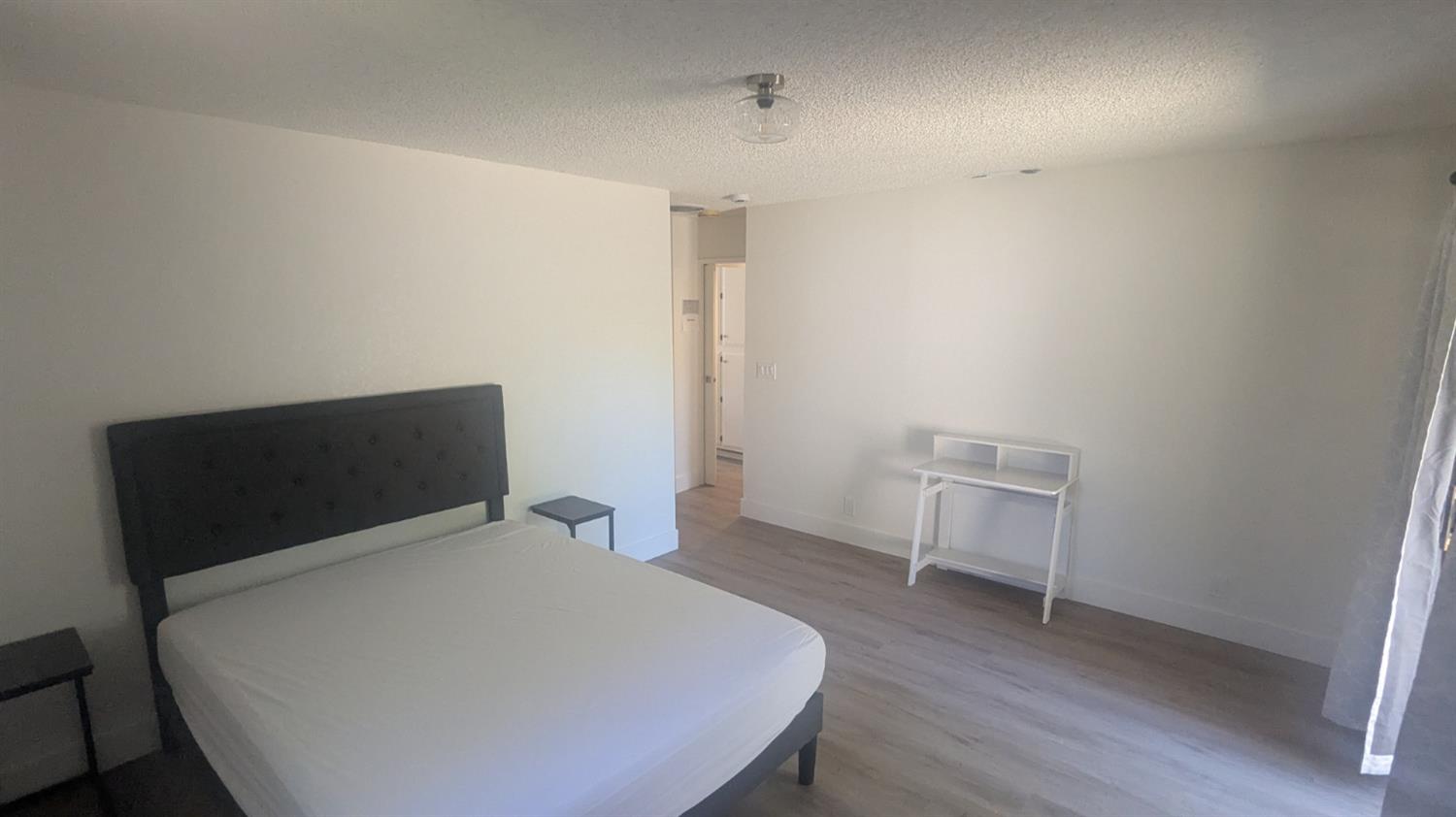 6851 Albury Street Citrus Heights, CA 95621 - Photo 11 of 22 a bedroom with a bed and wooden floor