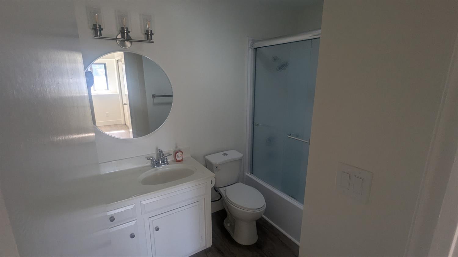 6851 Albury Street Citrus Heights, CA 95621 - Photo 12 of 22 a bathroom with a toilet sink and mirror