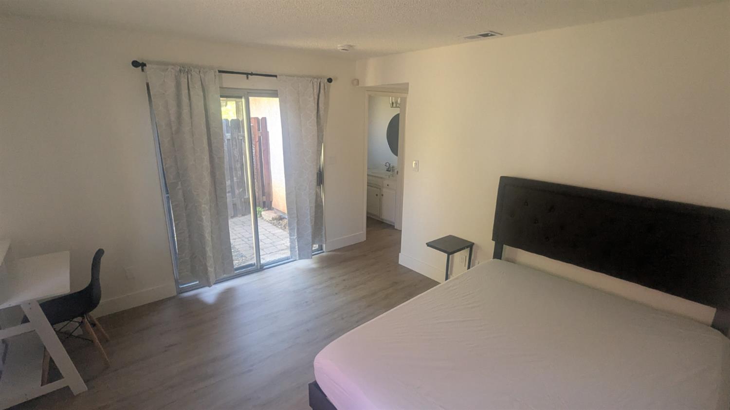 6851 Albury Street Citrus Heights, CA 95621 - Photo 16 of 22 a hallway with wooden floor and chair