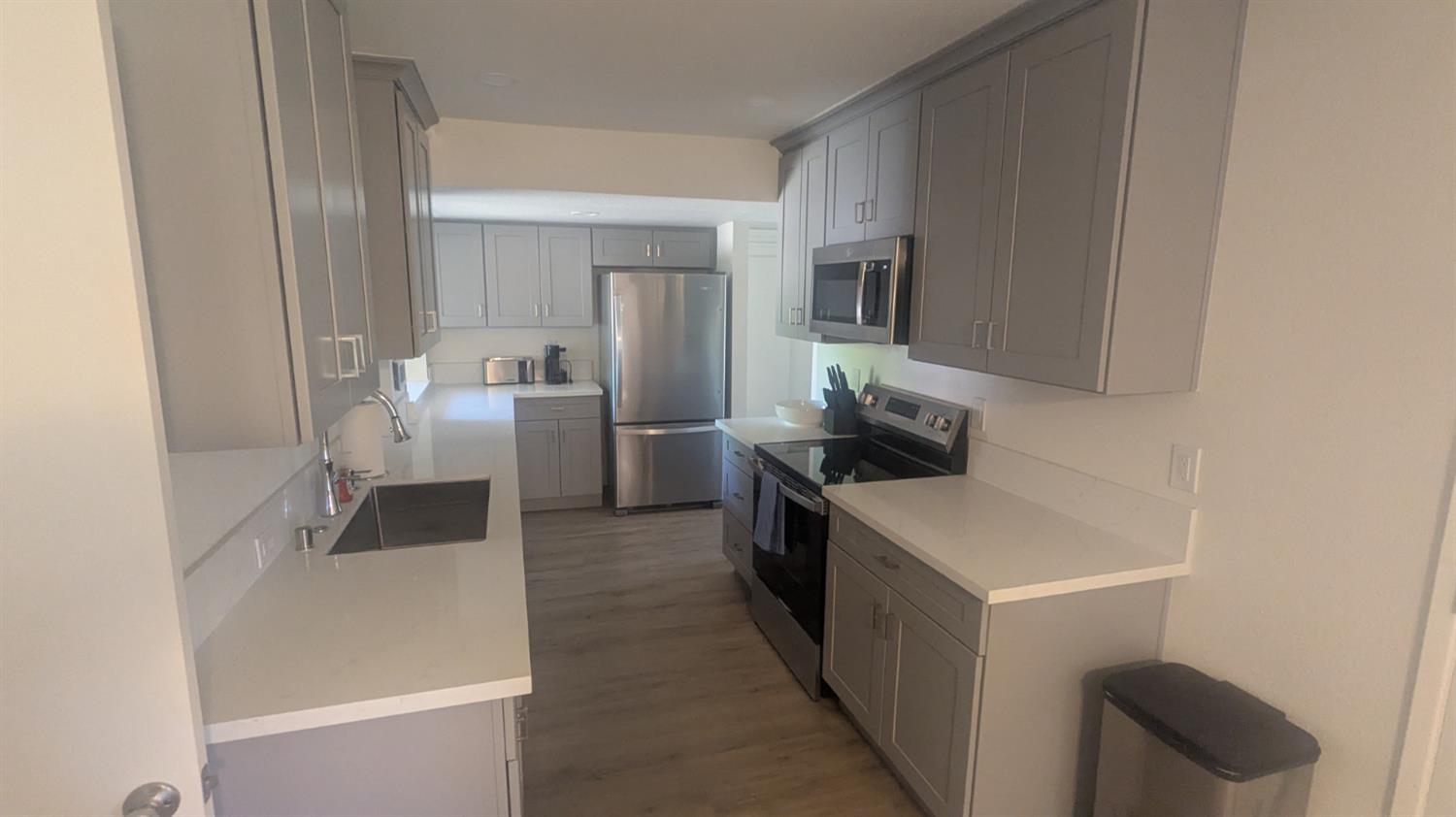 6851 Albury Street Citrus Heights, CA 95621 - Photo 3 of 22 a kitchen with a sink and chairs