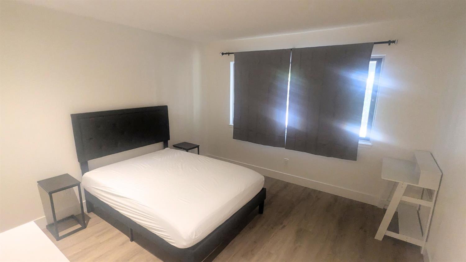 6851 Albury Street Citrus Heights, CA 95621 - Photo 7 of 22 a bedroom with a bed and a night stand