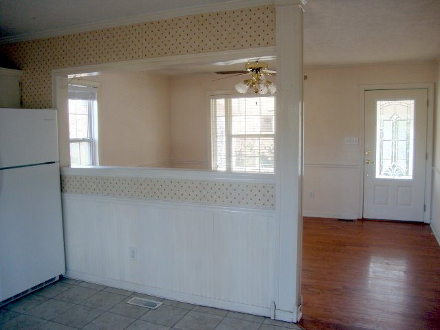 31 Anderson Road Forsyth, GA 31029 - Photo 4 of 8 an empty room with wooden floor and windows