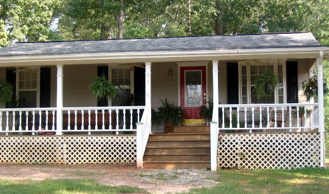 31 Anderson Road Forsyth, GA 31029 - Photo 7 of 8 a view of a house with a small deck and a garden