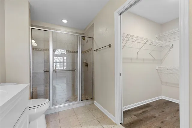a bathroom with a shower and a toilet