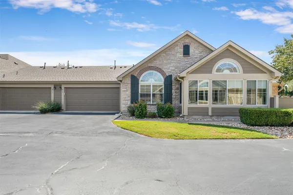 a front view of a house with swimming pool