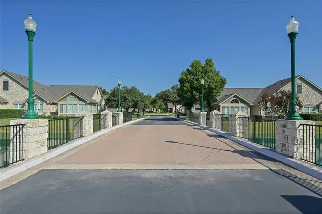 a view of house with yard and sitting area