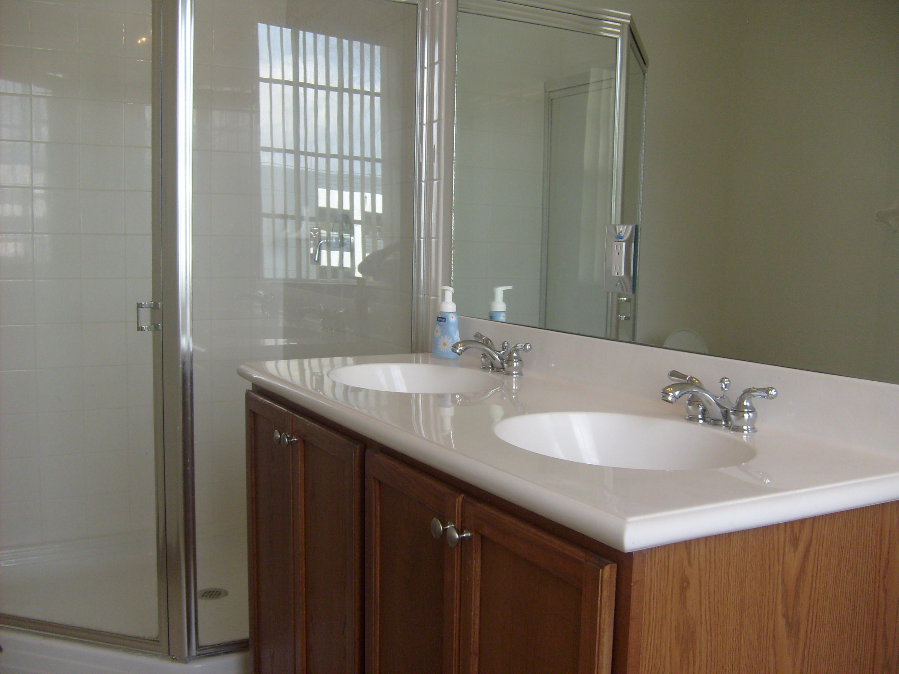 1865 Northwest 12th Street Boca Raton, FL 33431 - Photo 11 of 18 a bathroom with 2 sink and a large mirror
