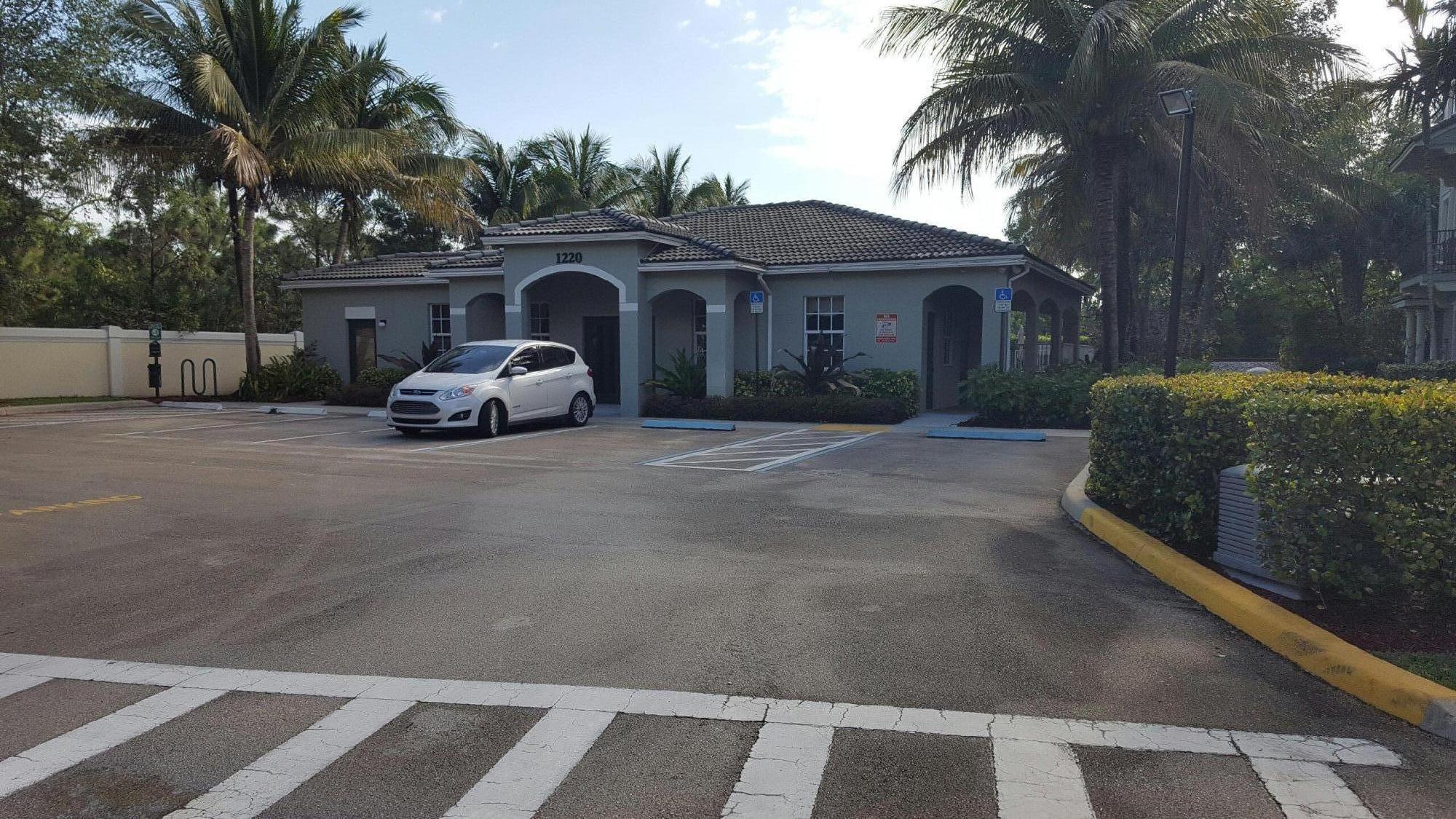 1865 Northwest 12th Street Boca Raton, FL 33431 - Photo 5 of 18 a view of a car in front of a house