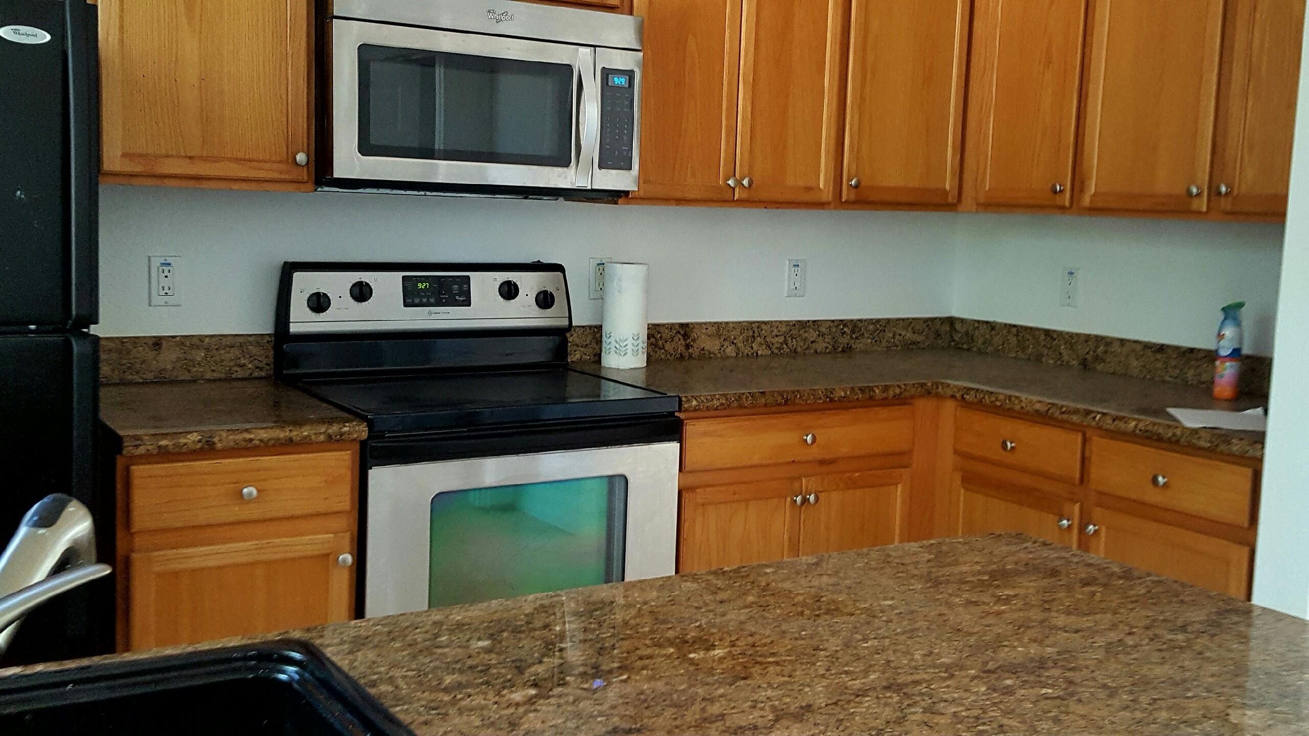 1865 Northwest 12th Street Boca Raton, FL 33431 - Photo 6 of 18 a kitchen with granite countertop cabinets stainless steel appliances and a sink