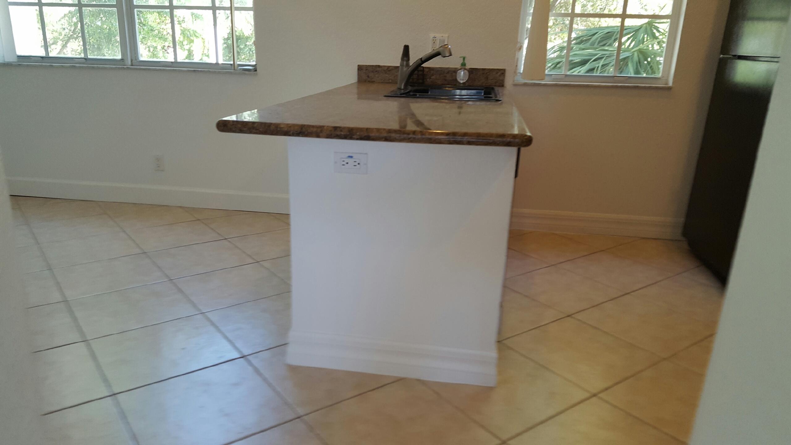 1865 Northwest 12th Street Boca Raton, FL 33431 - Photo 10 of 18 a bathroom with a granite countertop sink and window