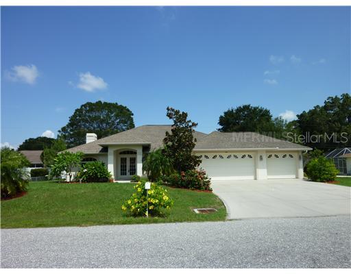 187 Argus Road Venice, FL 34293 - Photo 1 of 1 a front view of a house with a garden