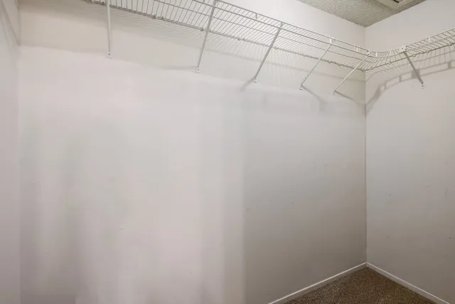 a view of a room with racks on the wall