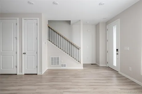 a view of entryway with wooden floor