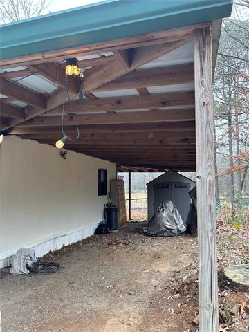 a view of a room with wooden walls