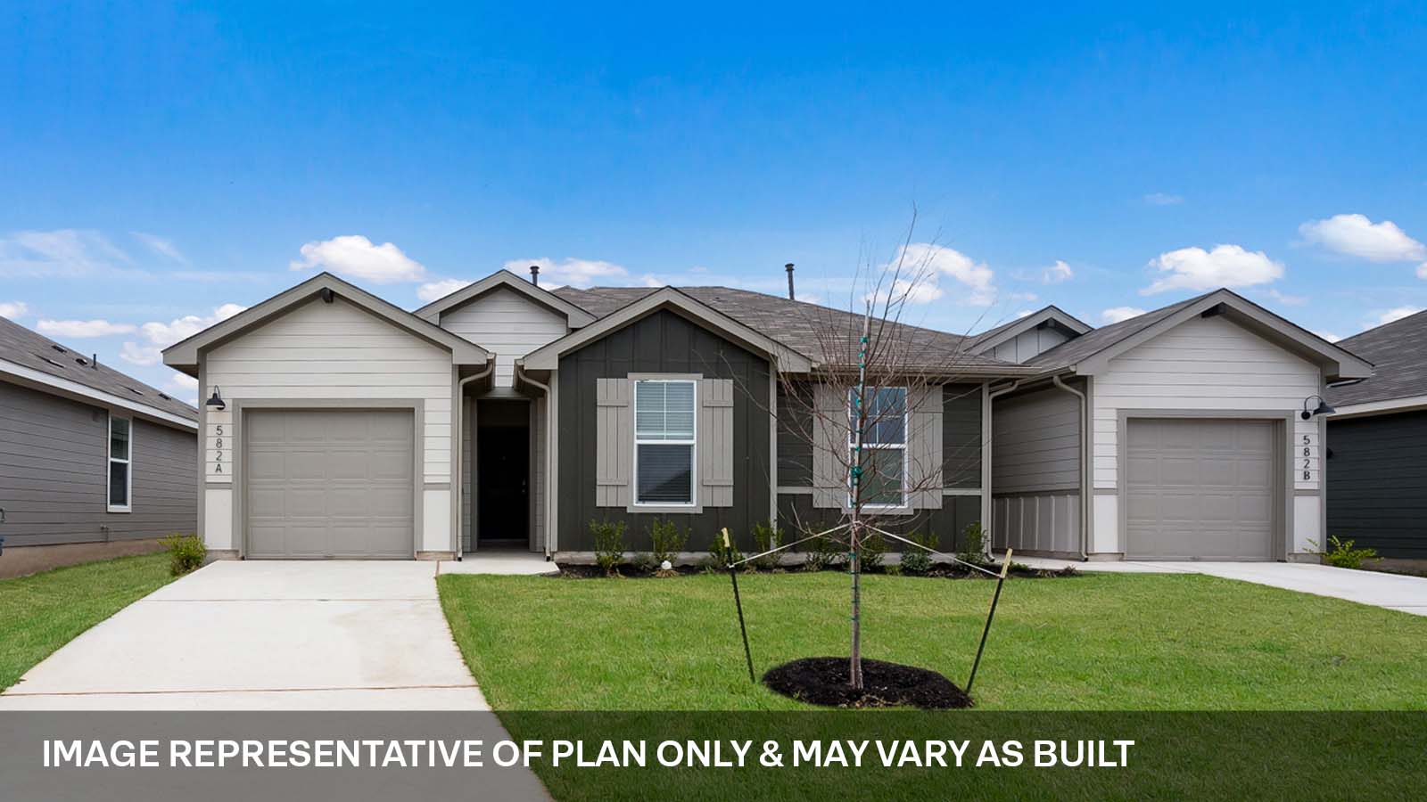 a view of a house with a yard and pathway