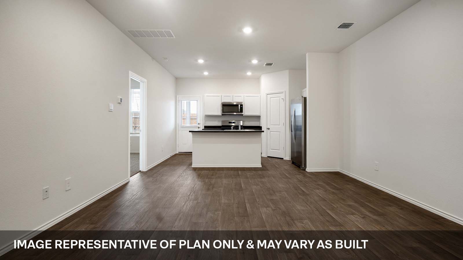 231 B Harrison Crossing Kyle, TX 78640 - Photo 4 of 19 a view of a kitchen with a sink and a refrigerator