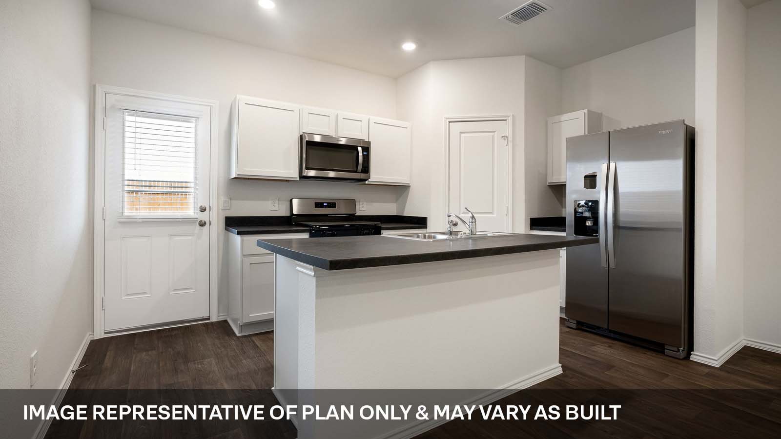 231 B Harrison Crossing Kyle, TX 78640 - Photo 6 of 19 a kitchen with stainless steel appliances a refrigerator a stove a microwave and a refrigerator