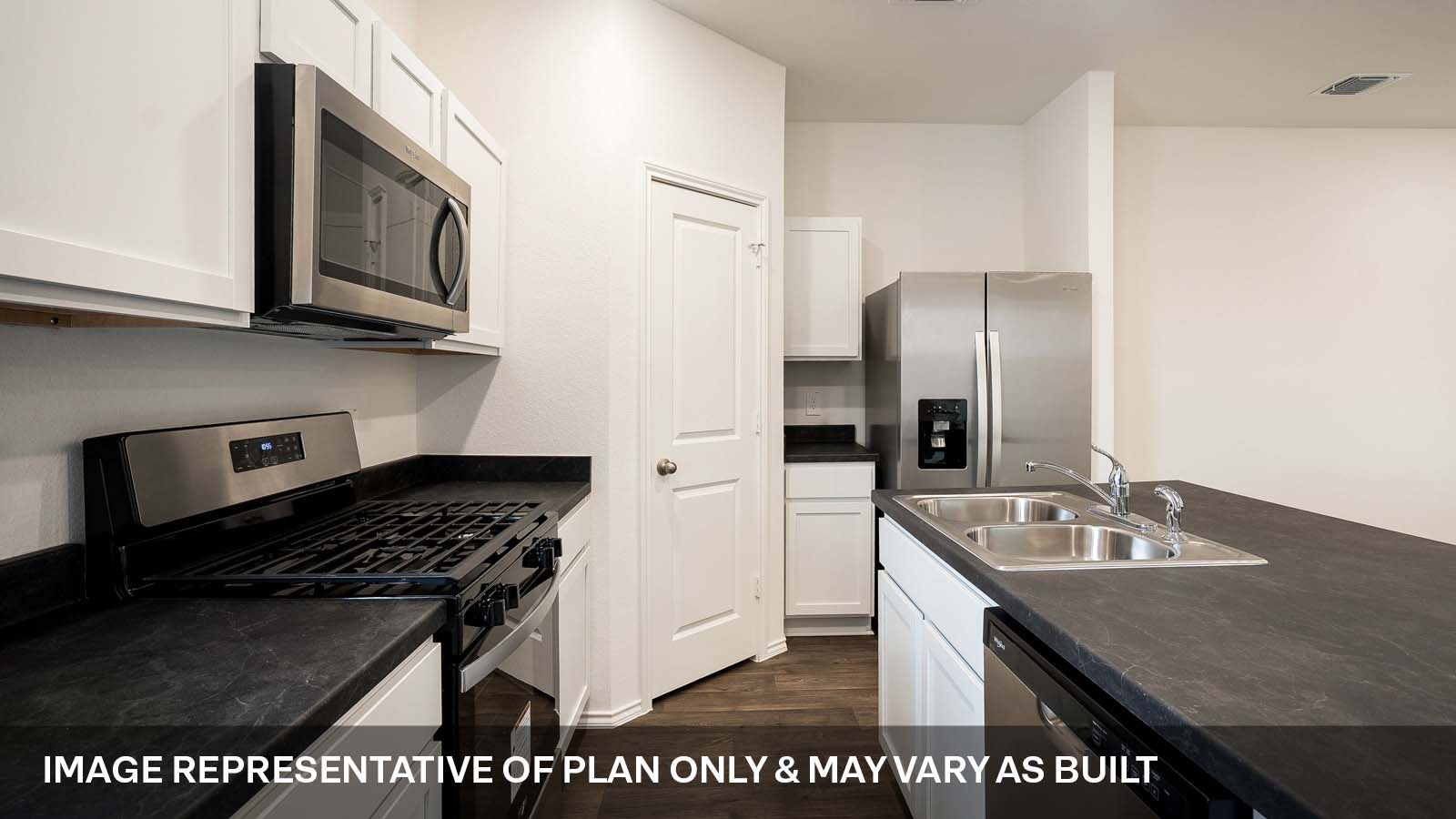 231 B Harrison Crossing Kyle, TX 78640 - Photo 7 of 19 a kitchen with stainless steel appliances granite countertop a sink stove and refrigerator