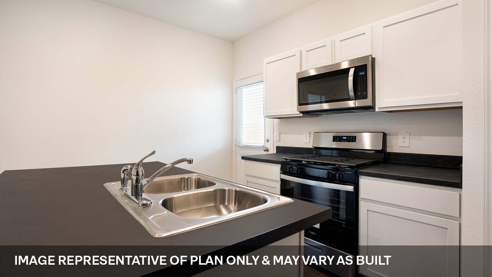 231 B Harrison Crossing Kyle, TX 78640 - Photo 8 of 19 a kitchen with a sink and a stove top oven