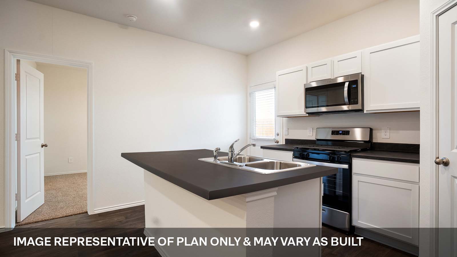 231 B Harrison Crossing Kyle, TX 78640 - Photo 9 of 19 a kitchen with stainless steel appliances granite countertop a sink a stove top oven a counter space and cabinets