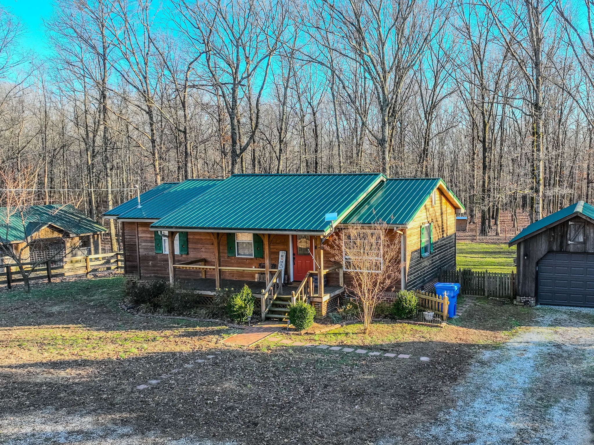 95 CC Road Lawrenceburg, TN 38464 - Photo 1 of 26 a view of a house with a yard and sitting area