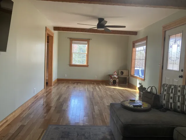 a kitchen with stainless steel appliances granite countertop a refrigerator a sink a stove and cabinets