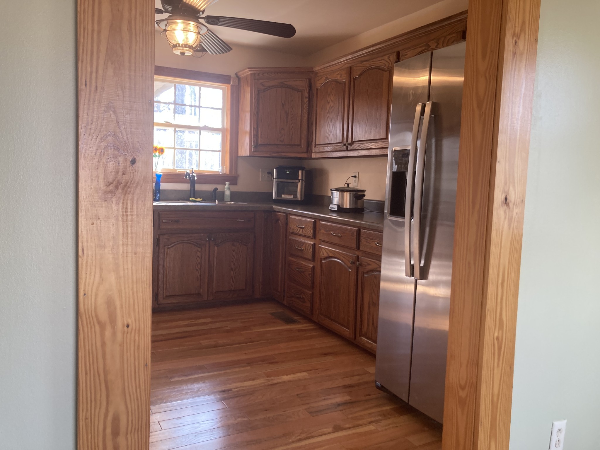 95 CC Road Lawrenceburg, TN 38464 - Photo 12 of 26 a kitchen with stainless steel appliances granite countertop a refrigerator a sink a stove and cabinets