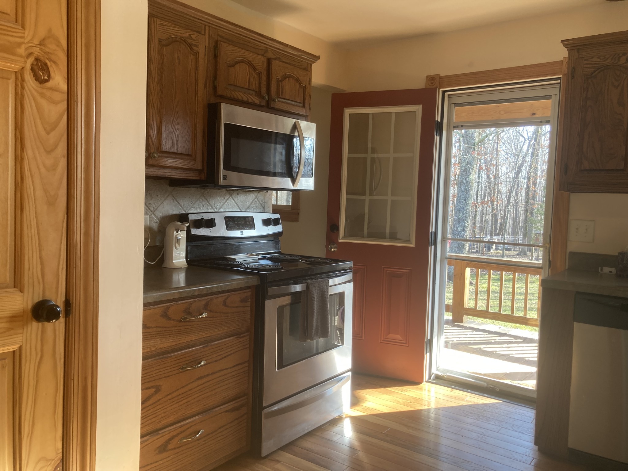 95 CC Road Lawrenceburg, TN 38464 - Photo 13 of 26 a kitchen with a stove and a microwave