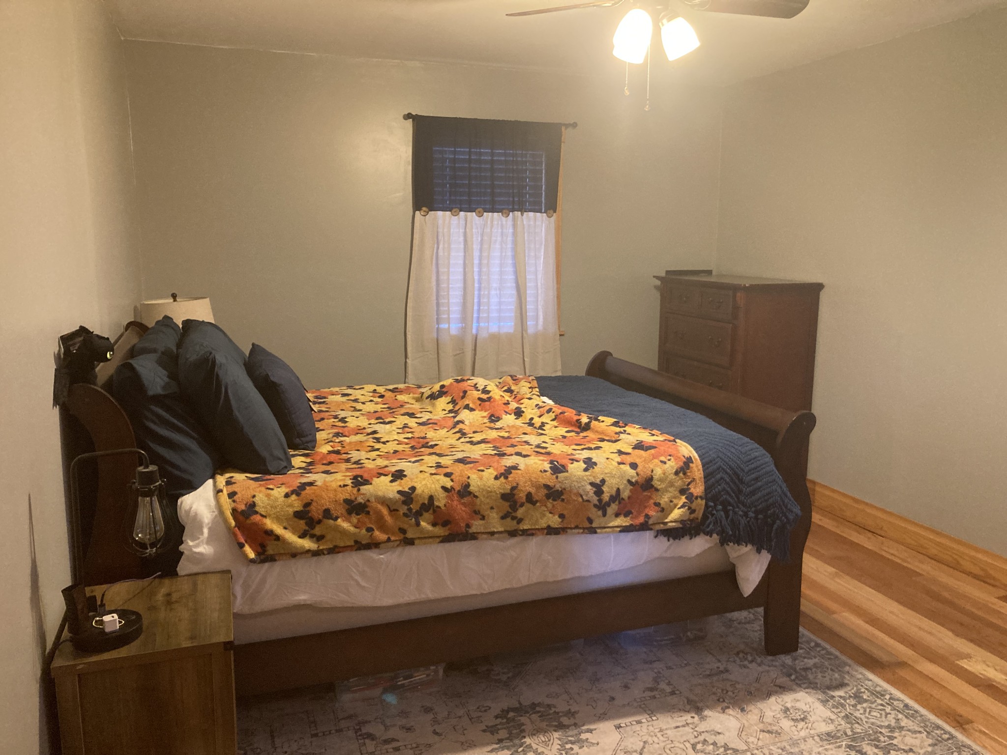 95 CC Road Lawrenceburg, TN 38464 - Photo 19 of 26 a bed sitting in a bedroom next to a window