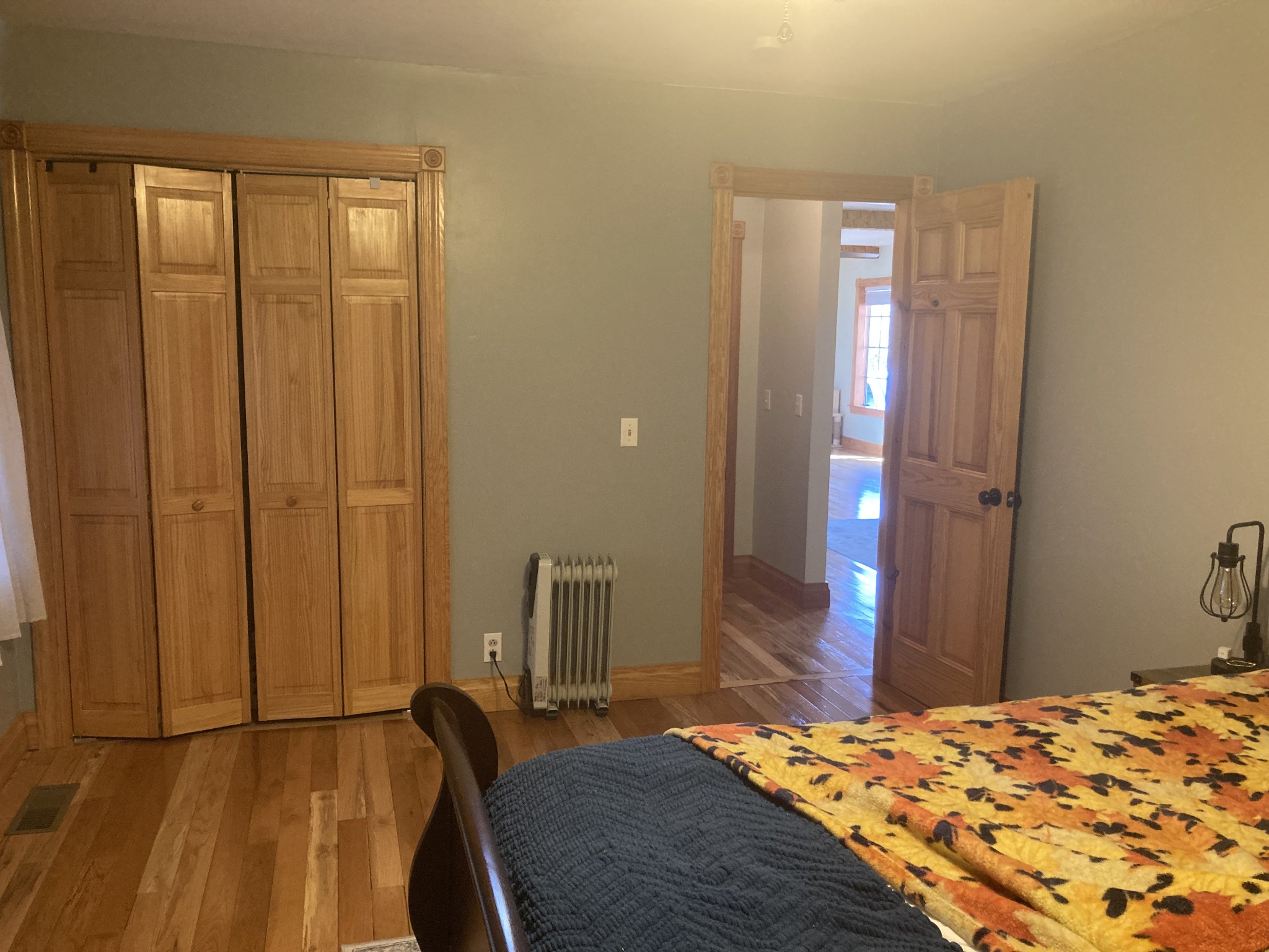 95 CC Road Lawrenceburg, TN 38464 - Photo 20 of 26 a bedroom with a bed and wooden floor