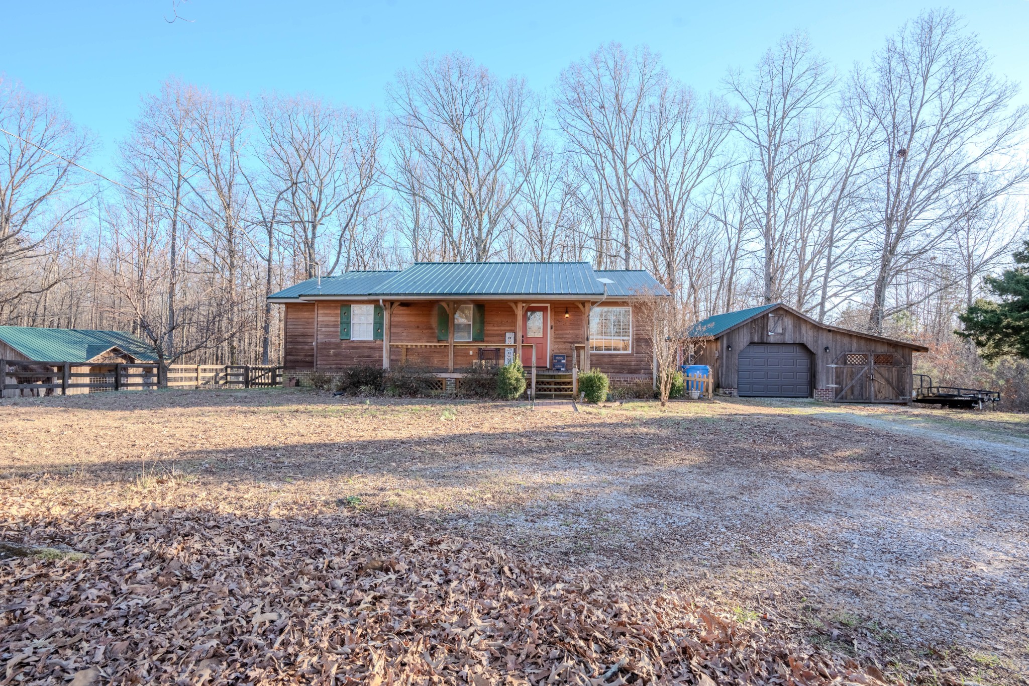 95 CC Road Lawrenceburg, TN 38464 - Photo 2 of 26 a front view of a house with a yard and garage