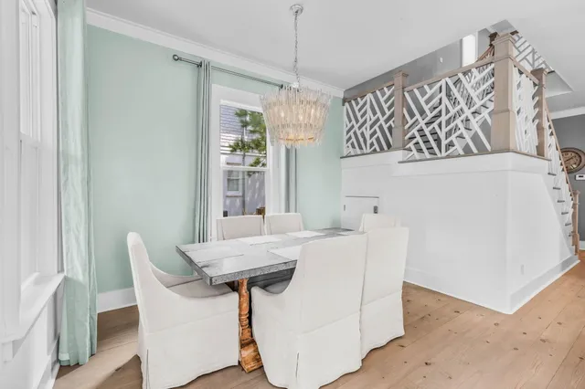 a view of a dining room with furniture and window