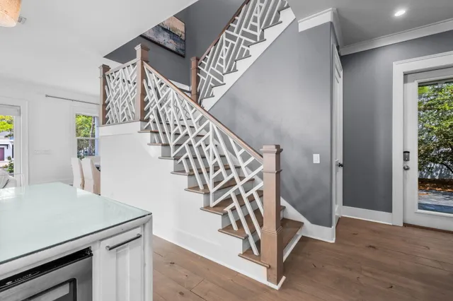 a view of entryway and hall with wooden floor