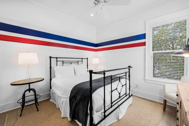 a bedroom with a bed and a window