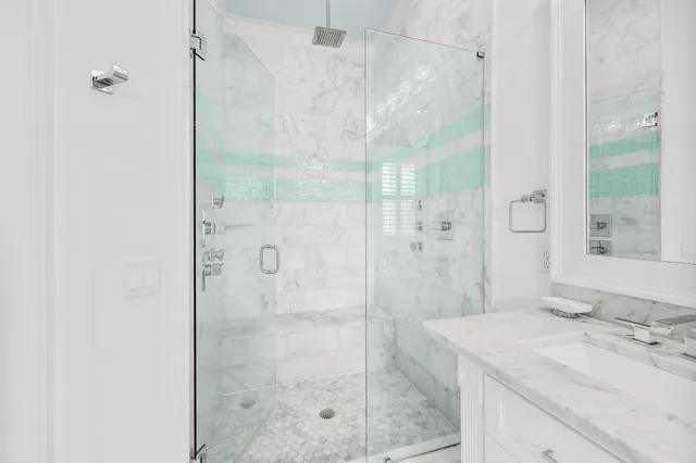 a bathroom with a shower and a sink