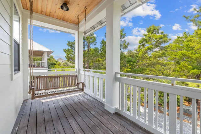 a view of balcony with wooden floor