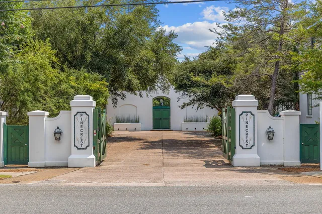 a front view of a house with parking area