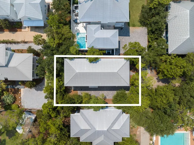 an aerial view of house with swimming pool