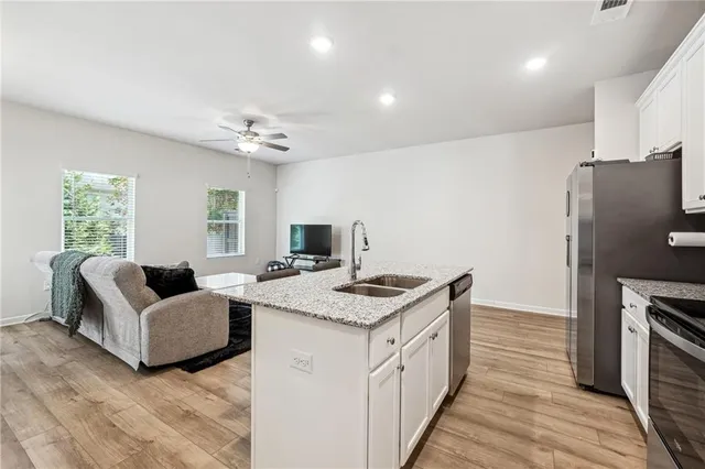 a spacious bedroom with a bed and a couch