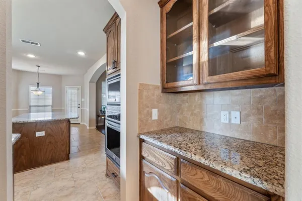 a kitchen with stainless steel appliances granite countertop a stove and a sink