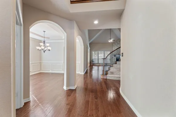 a view of a hallway view with wooden floor