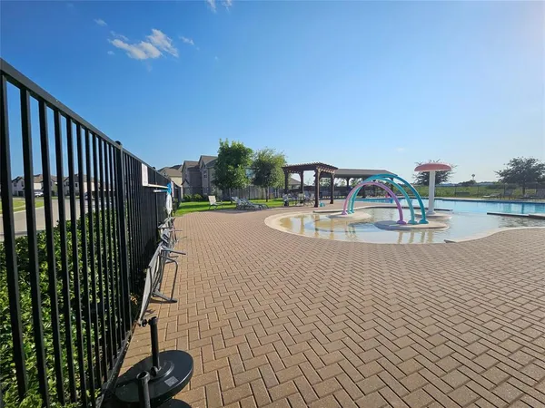 a view of a swimming pool with a patio